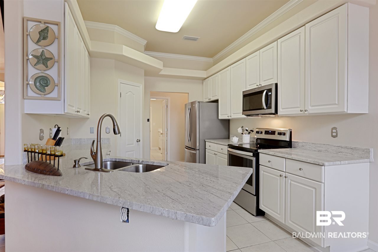 30460 Ono N Loop West Orange Beach, AL 36561 - Photo 4 of 17 New granite, SS appliances, kitchen hardware
