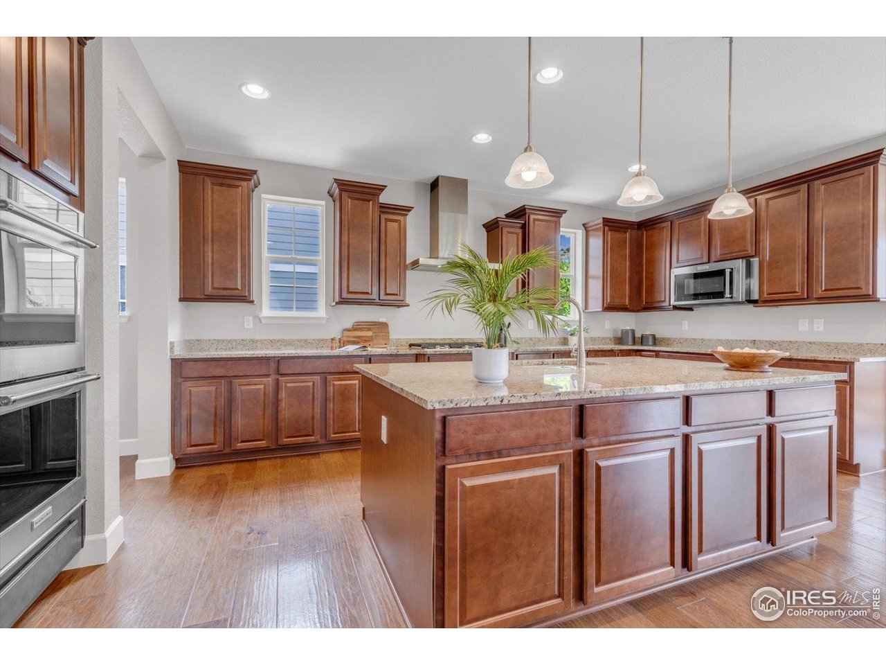 2264 Front Range Road Erie, CO 80516 - Photo 13 of 40 Countertops and Cabinets abound in this Kitchen!