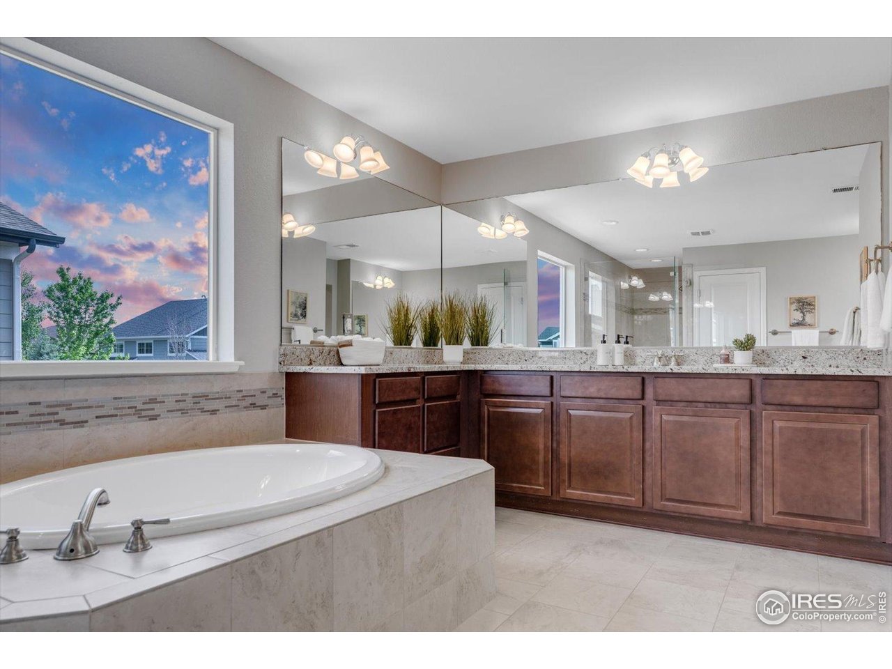 2264 Front Range Road Erie, CO 80516 - Photo 23 of 40 Primary Bath separate Vanities/Sinks, Deep Soaking Tub