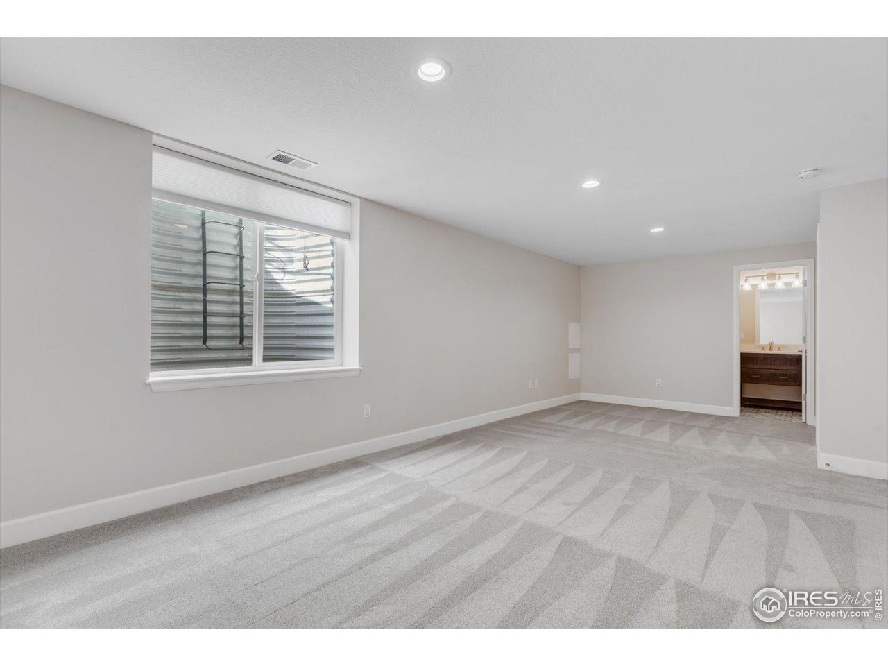 2264 Front Range Road Erie, CO 80516 - Photo 32 of 40 Basement Guest Bedroom with 3/4 En Suite Bath & Huge closet