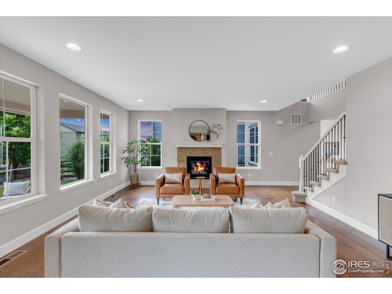 2264 Front Range Road Erie, CO 80516 - Photo 10 of 40 Light filled Family Room w/Fireplace