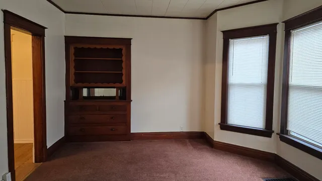 a view of an empty room and closet