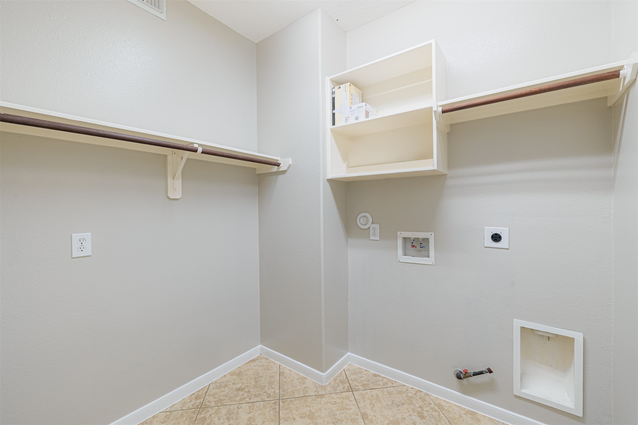 8322 Encinitas Cove Drive Tomball, TX 77375 - Photo 15 of 24 a view of walk in closet with empty racks