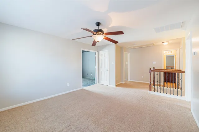 a view of a livingroom with a ceiling fan