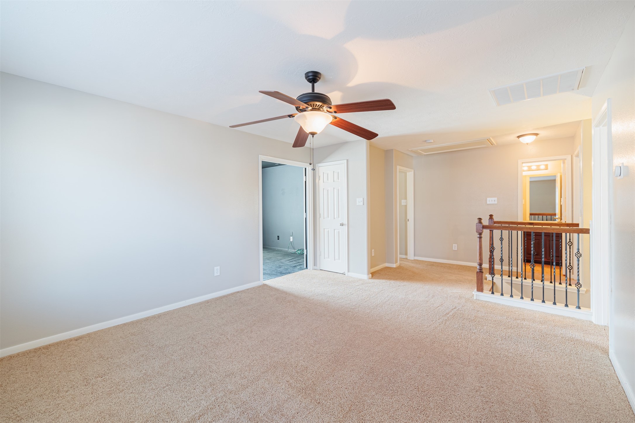 8322 Encinitas Cove Drive Tomball, TX 77375 - Photo 18 of 24 a view of a livingroom with a ceiling fan