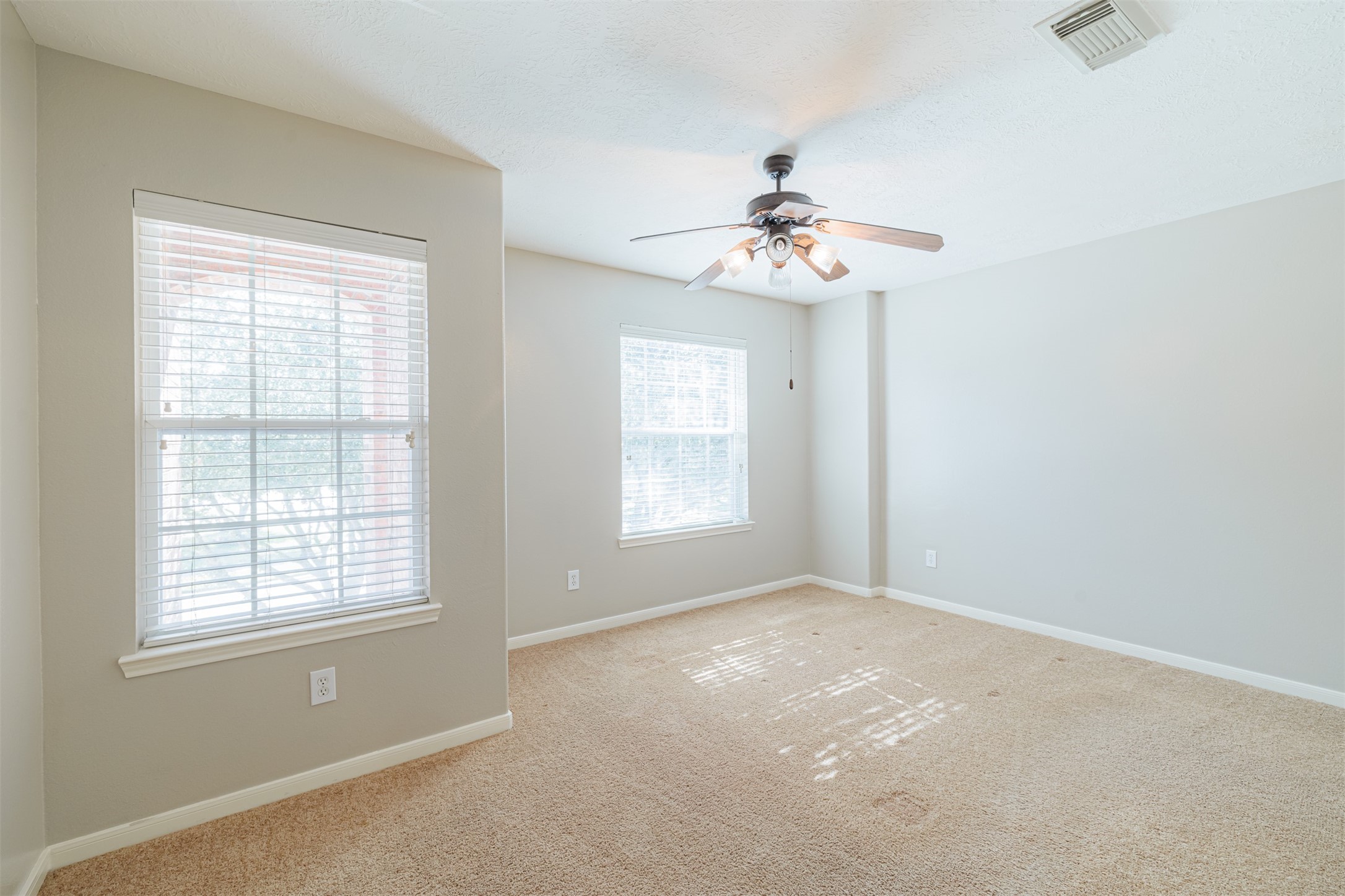 8322 Encinitas Cove Drive Tomball, TX 77375 - Photo 21 of 24 a view of an empty room with a window