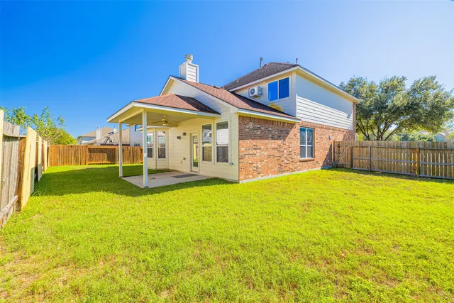 a view of a house with swimming pool and porch with furniture