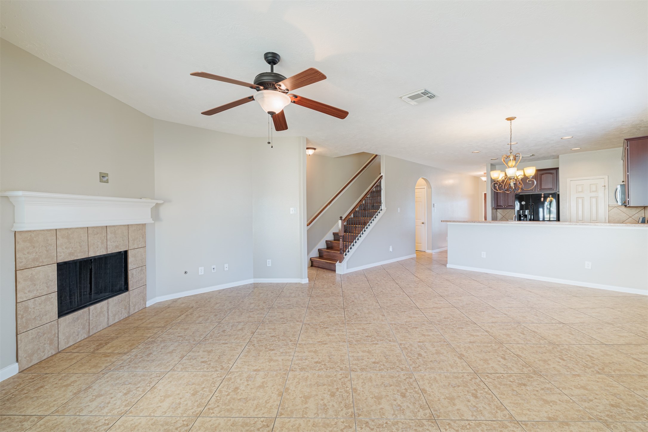 8322 Encinitas Cove Drive Tomball, TX 77375 - Photo 8 of 24 a view of an empty room with a fireplace