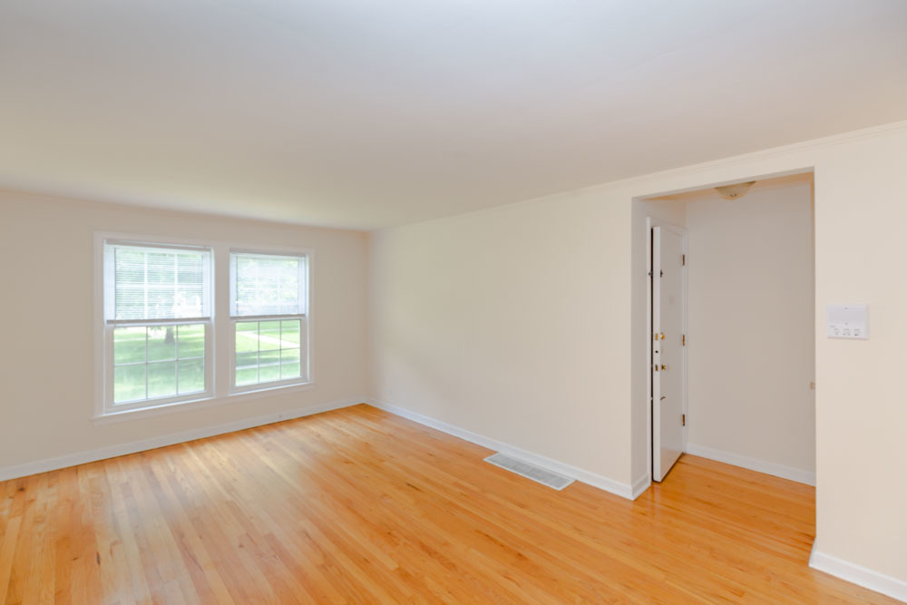 4245 West Nelson Street, Unit 1 Chicago, IL 60641 - Photo 4 of 9 a view of an empty room with wooden floor and a window