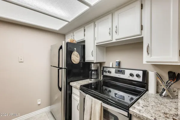 a kitchen with stainless steel appliances a refrigerator and a sink