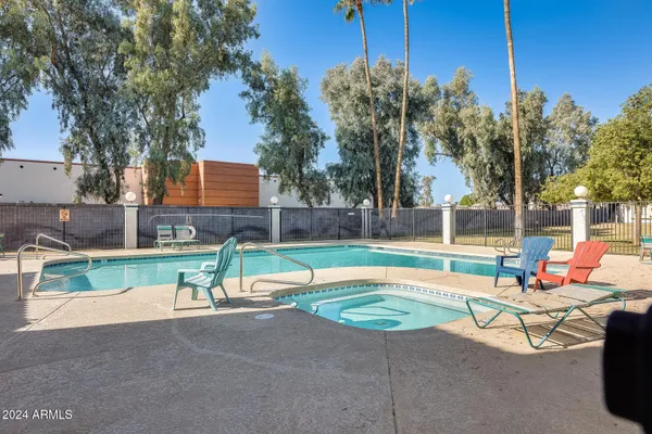 a view of backyard with a table and chairs