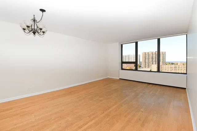 a view of an empty room with a window