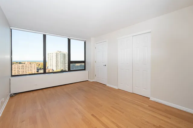 a view of an empty room with a window