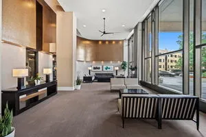 a view of a tall building with a swimming pool