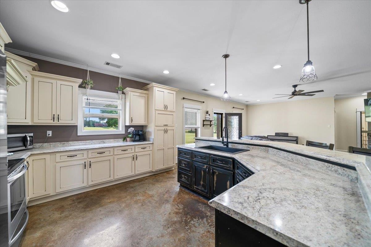 206 Deen Road Brighton, TN 38011 - Photo 14 of 35 Spacious kitchen featuring an expansive island with a built-in sink and a breakfast bar