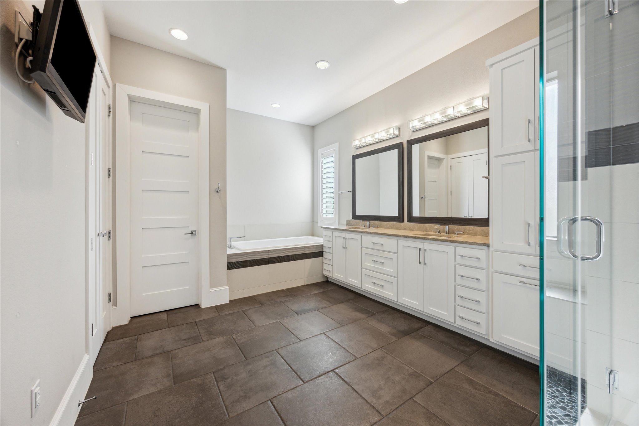 2604 Arion Circle Austin, TX 78730 - Photo 12 of 23 a bathroom with a double vanity sink and mirror