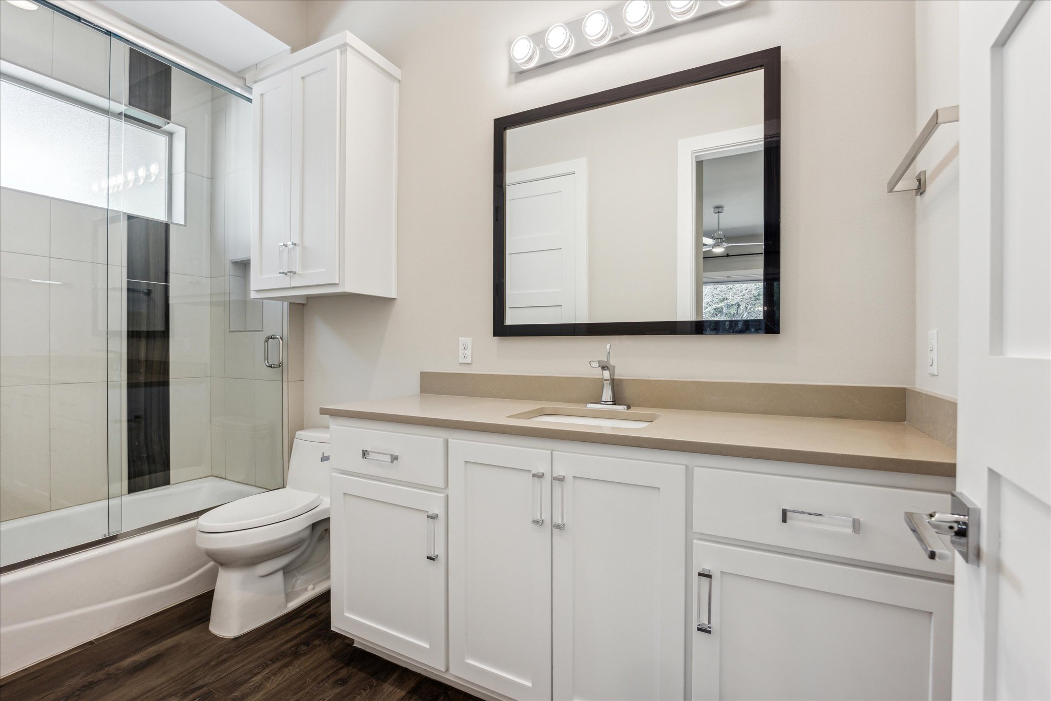 2604 Arion Circle Austin, TX 78730 - Photo 17 of 23 a bathroom with a toilet a sink a tub and mirror