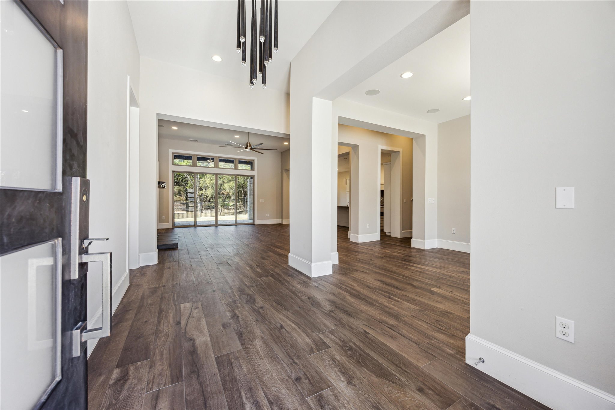 2604 Arion Circle Austin, TX 78730 - Photo 2 of 23 a view of a hallway with wooden floor and staircase