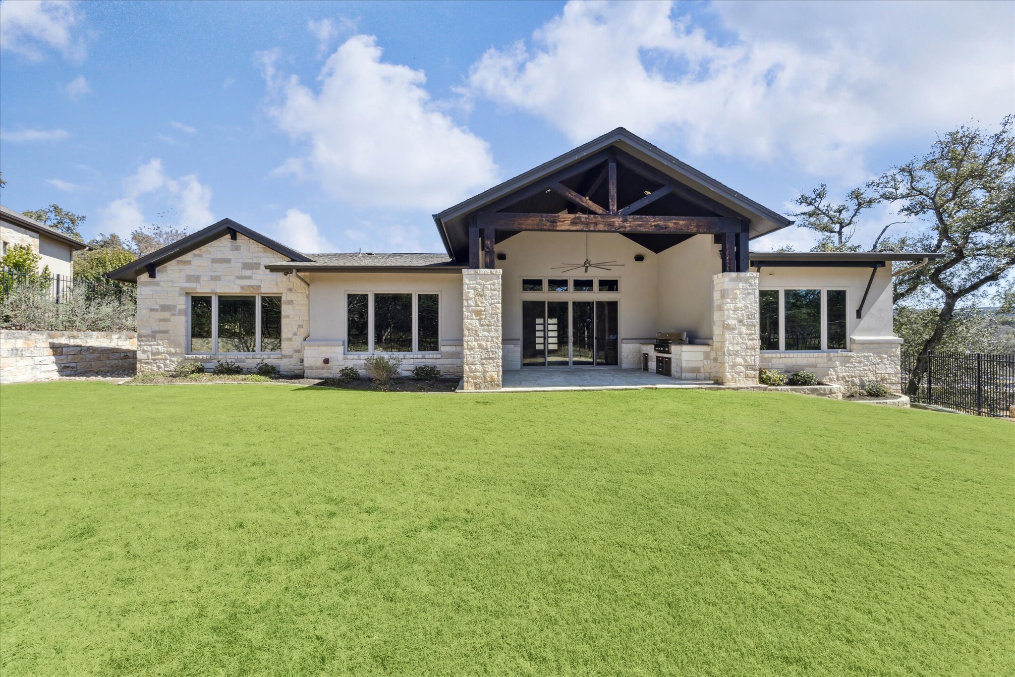 2604 Arion Circle Austin, TX 78730 - Photo 22 of 23 a front view of a house with a garden and yard
