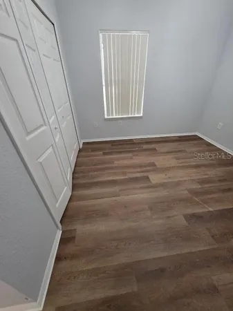 a view of an empty room and window