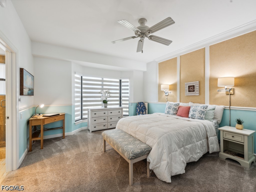 232 La Peninsula Boulevard, Unit 232 Naples, FL 34113 - Photo 20 of 44 a bedroom with a bed and a chandelier