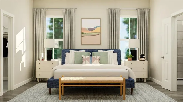 a bedroom with a bed table and a window