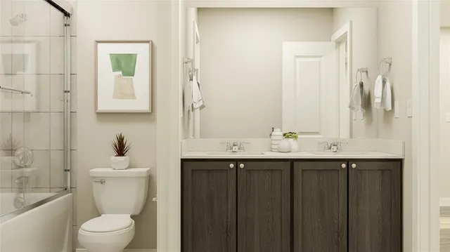 a bathroom with a sink vanity mirror and toilet