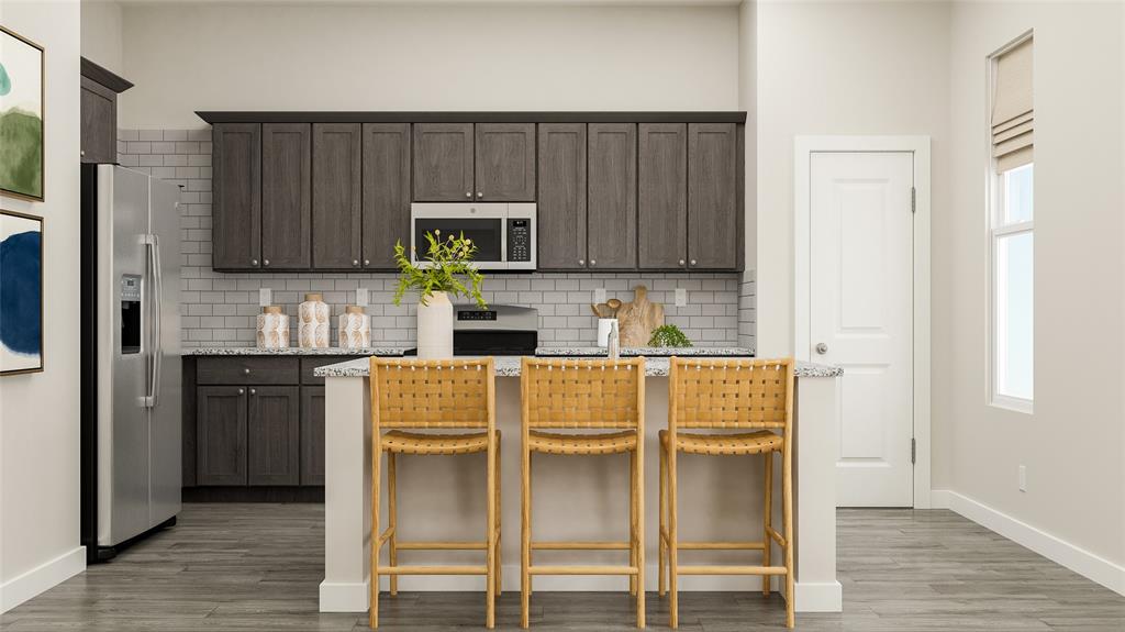 4314 Stonybrook Road Arlington, TX 76012 - Photo 5 of 22 a kitchen with stainless steel appliances granite countertop a refrigerator and microwave
