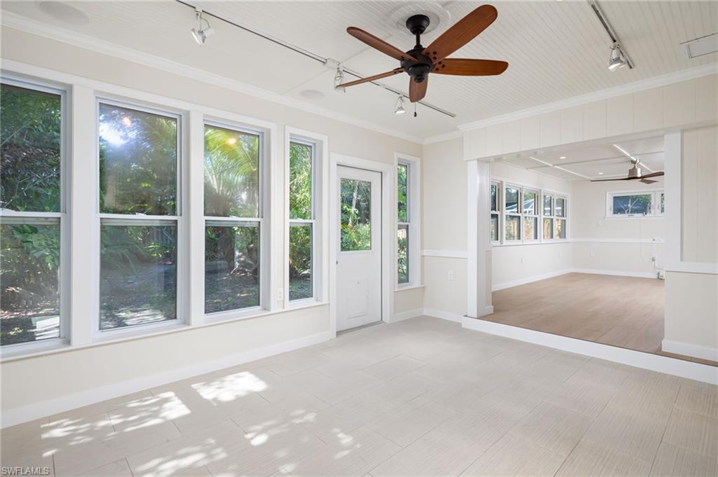 2424 Harbor Road Naples, FL 34104 - Photo 11 of 26 a view of a livingroom with a ceiling fan and window