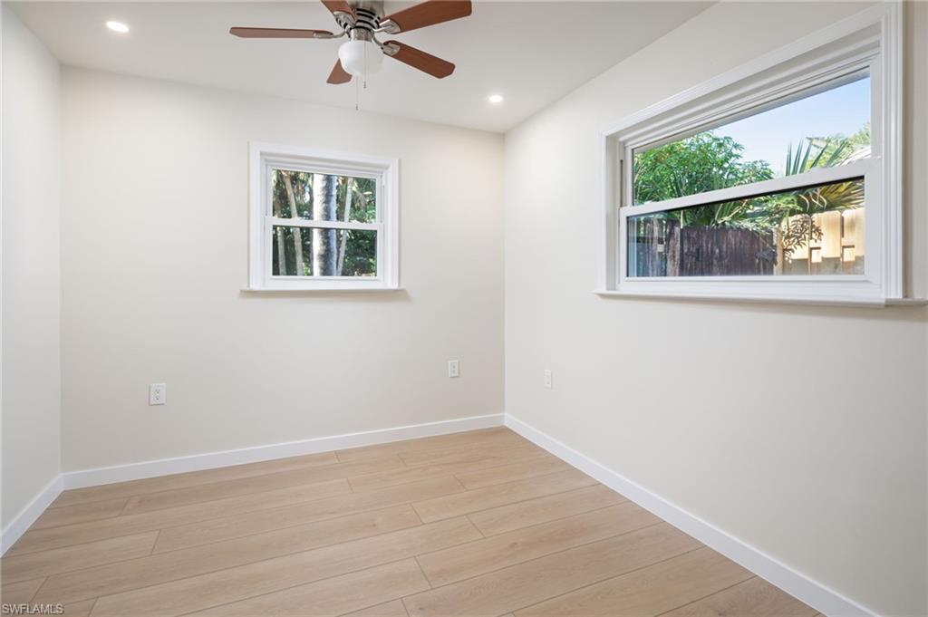 2424 Harbor Road Naples, FL 34104 - Photo 18 of 26 an empty room with window and ceiling fan