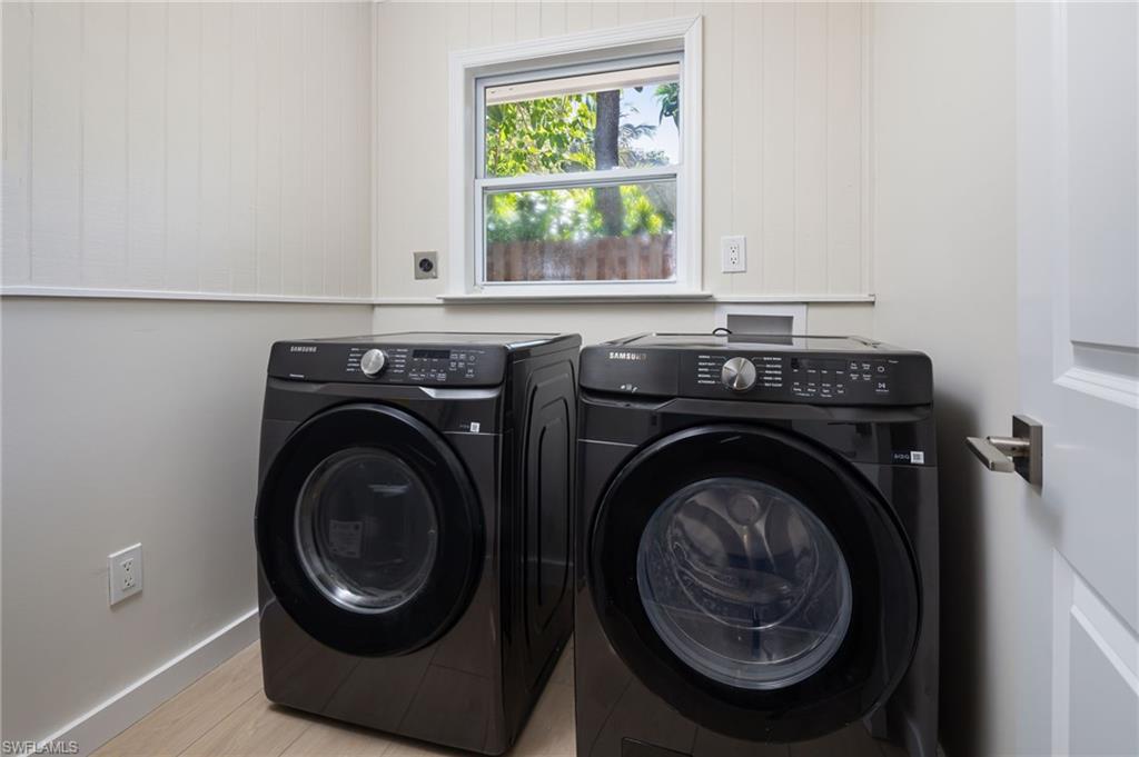 2424 Harbor Road Naples, FL 34104 - Photo 19 of 26 a utility room with dryer and washer