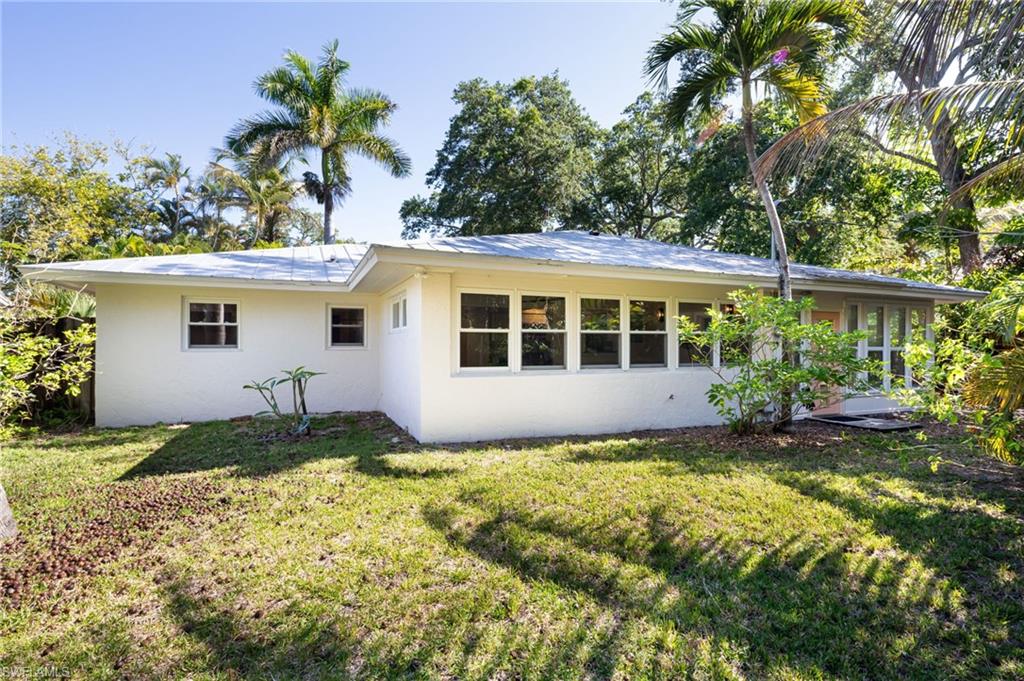 2424 Harbor Road Naples, FL 34104 - Photo 22 of 26 a view of a house with a yard