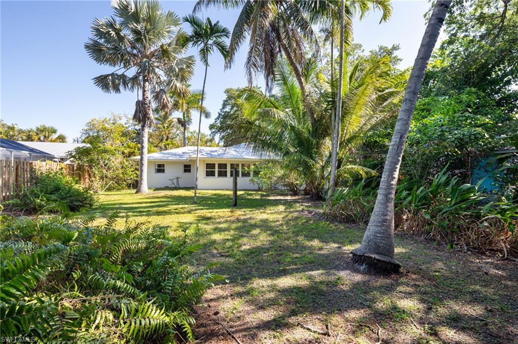 2424 Harbor Road Naples, FL 34104 - Photo 23 of 26 a view of a house with a yard