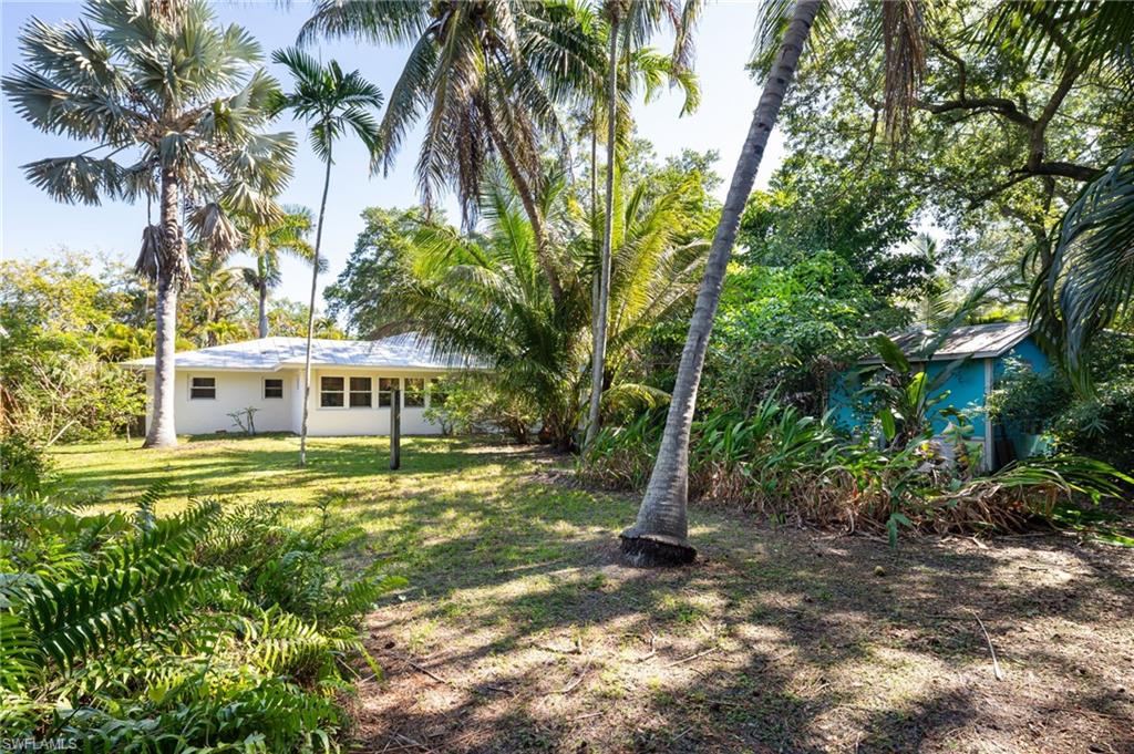 2424 Harbor Road Naples, FL 34104 - Photo 24 of 26 a view of a house with a yard
