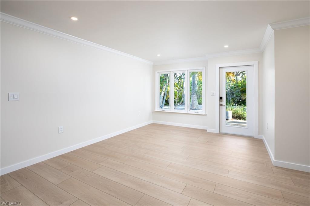 2424 Harbor Road Naples, FL 34104 - Photo 3 of 26 an empty room with windows and closet