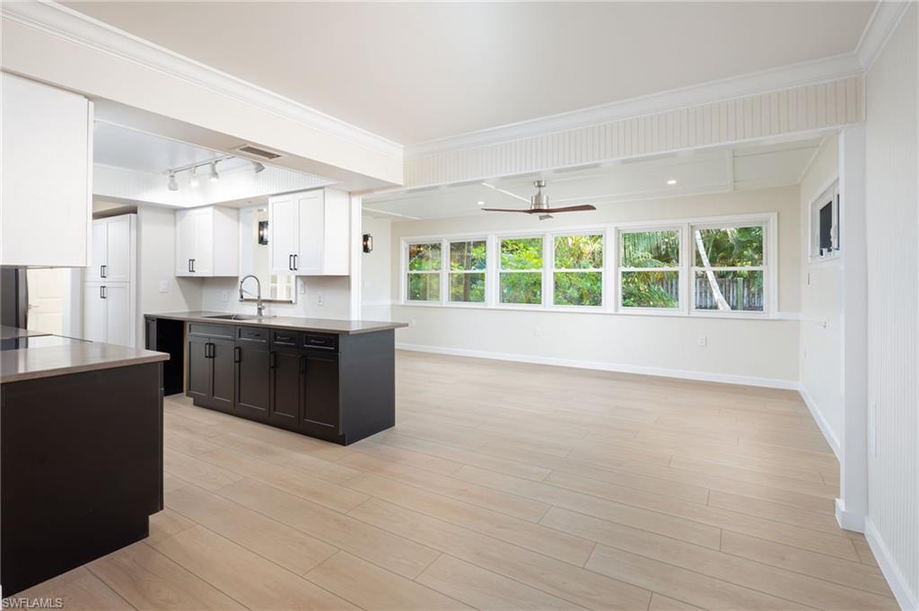 2424 Harbor Road Naples, FL 34104 - Photo 5 of 26 a large kitchen with a sink and cabinets