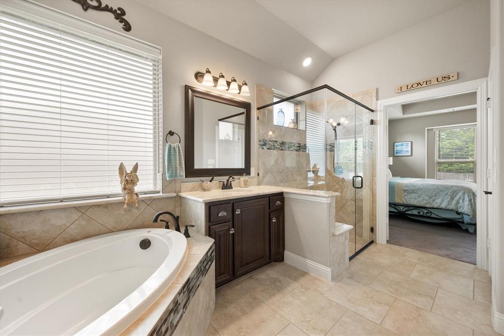 445 Rusty Run Drive Midlothian, TX 76065 - Photo 26 of 40 a bathroom with a tub sink shower and mirror