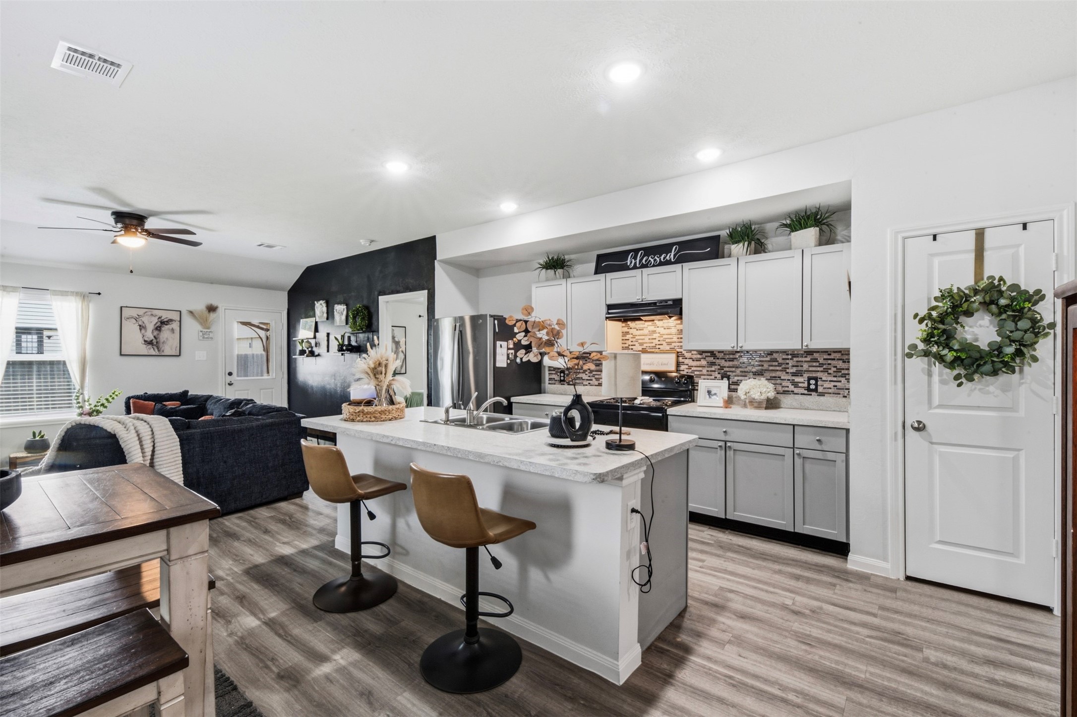 1523 22nd Street Hempstead, TX 77445 - Photo 4 of 26 Open-concept kitchen with large island and seamless flow into the living area.