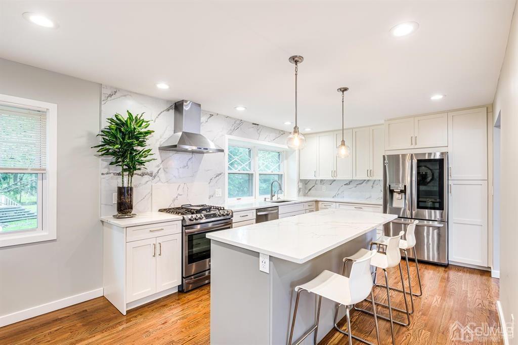 14 Tamarack Road Edison, NJ 08820 - Photo 11 of 40 a kitchen with a sink a stove a refrigerator and wooden floor