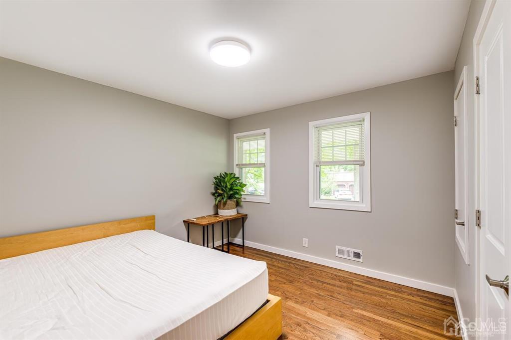 14 Tamarack Road Edison, NJ 08820 - Photo 24 of 40 a bed room with a bed and a table