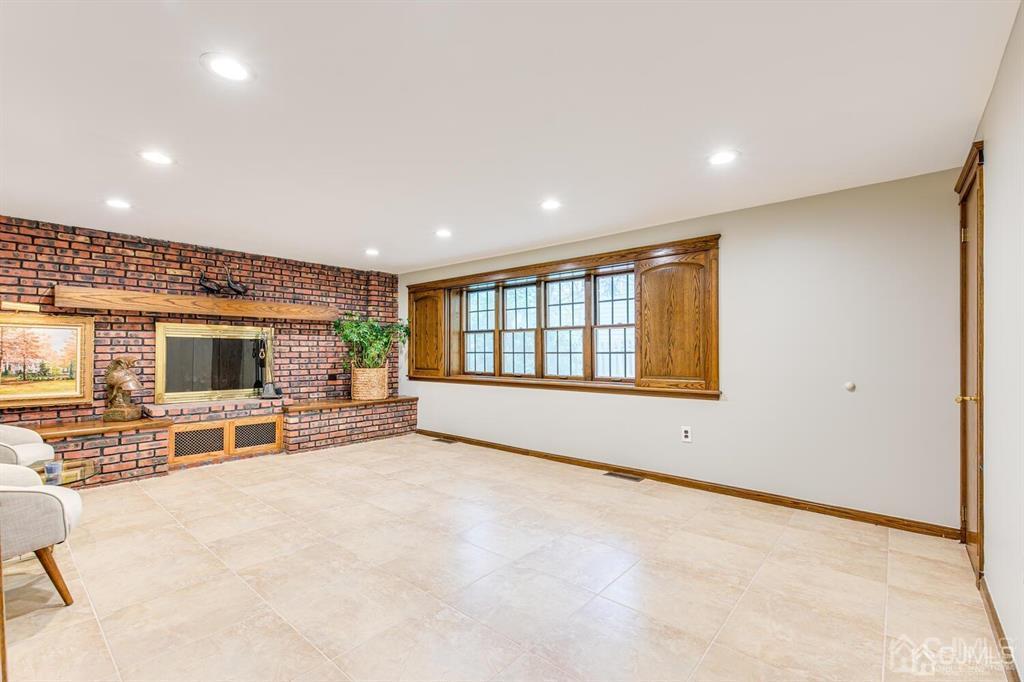 14 Tamarack Road Edison, NJ 08820 - Photo 27 of 40 a view of livingroom with furniture and flat screen tv