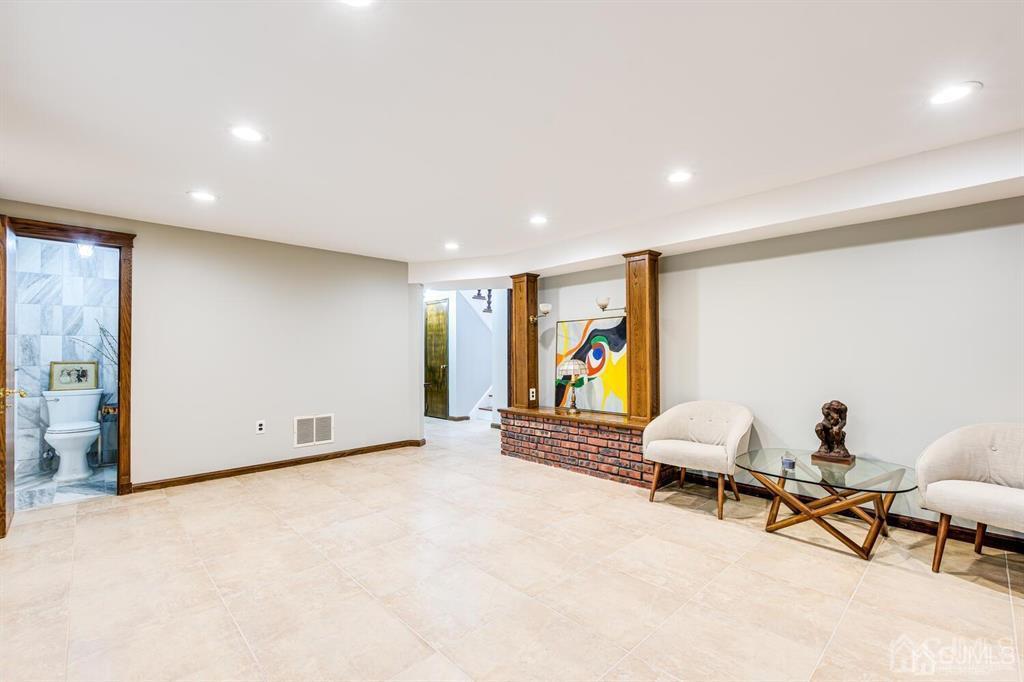 14 Tamarack Road Edison, NJ 08820 - Photo 28 of 40 a view of a livingroom with furniture and a couch