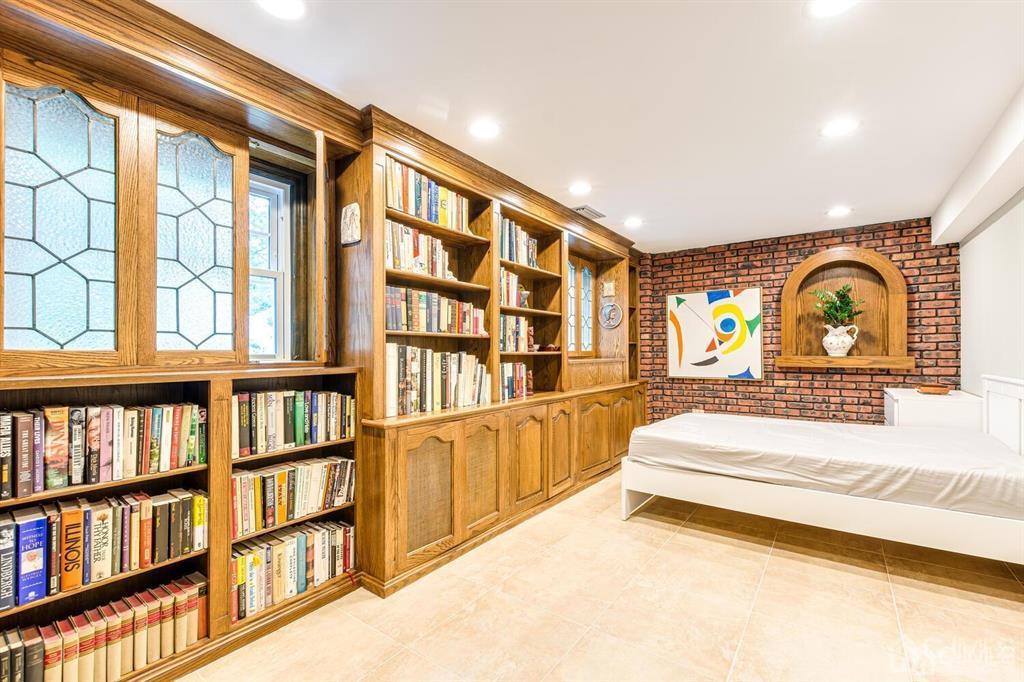 14 Tamarack Road Edison, NJ 08820 - Photo 30 of 40 a bedroom with furniture and a book shelf