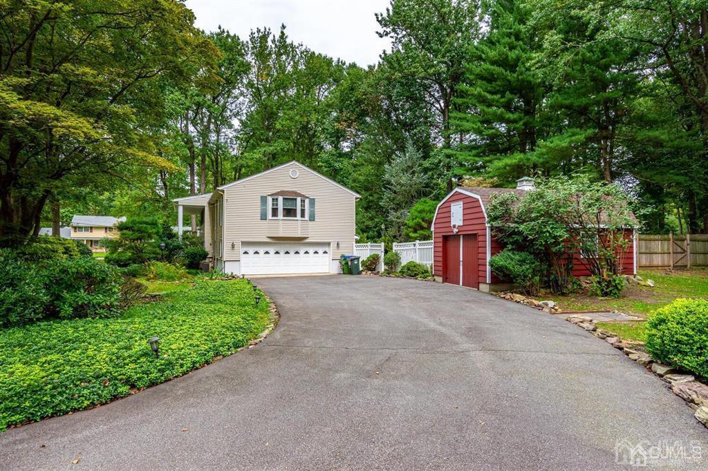 14 Tamarack Road Edison, NJ 08820 - Photo 3 of 40 a front view of a house with a yard and garden