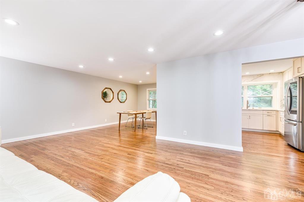 14 Tamarack Road Edison, NJ 08820 - Photo 9 of 40 a view of an empty room with window and wooden floor