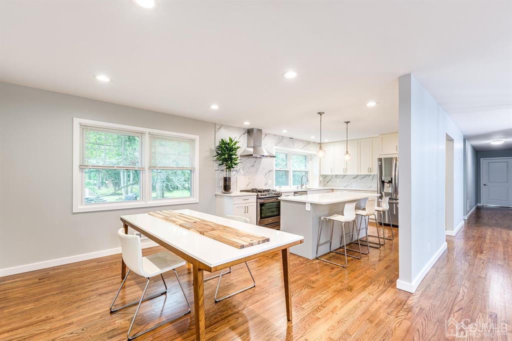14 Tamarack Road Edison, NJ 08820 - Photo 10 of 40 a kitchen with a table and chairs in it