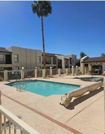 a view of a house with backyard and a garden