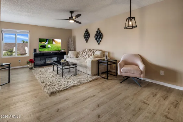 a living room with furniture and a flat screen tv