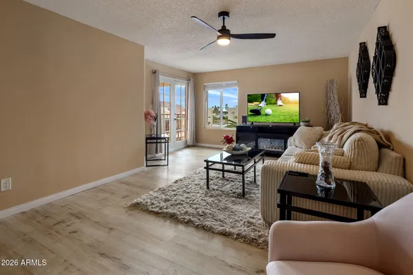 a living room with furniture and a flat screen tv