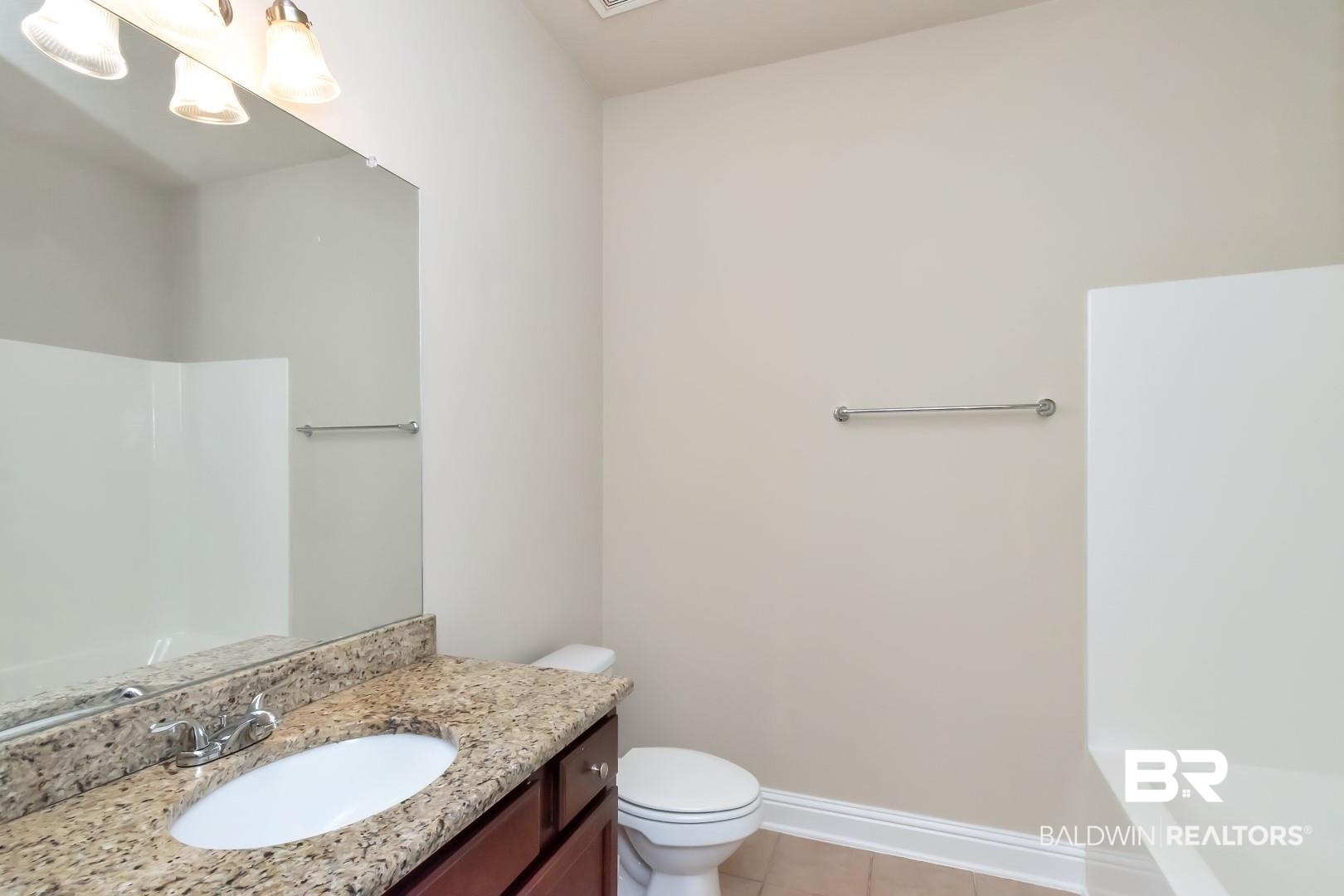 6144 Whitebark Drive Mobile, AL 36693 - Photo 18 of 33 Bathroom featuring tile patterned flooring, a bath, vanity, and toilet